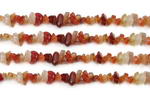 Carnelian, 5-7mm chips, natural gems. Sold per 36-inch strand